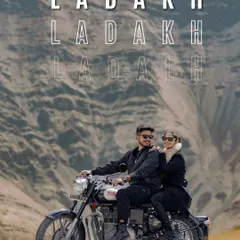 Adventure awaits in Ladakh. This shot captures the thrill of the journey on a classic Royal Enfield against the rugged mountain terrain.