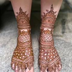 A classic full coverage bridal foot design with beautiful symmetry and a mix of floral and geometric patterns.