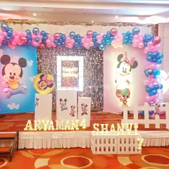A closer look at the themed stage decor, showing the illuminated name and age signs. These personalized details make the celebration feel extra special for the children.