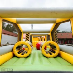 An inflatable obstacle course that provides a fun challenge for kids and even adults. It's a great way to get everyone active and laughing.