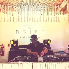 Behind the decks at a cool beach bar in Thailand. My international experience allows me to connect with diverse crowds and create a party atmosphere no matter the country.