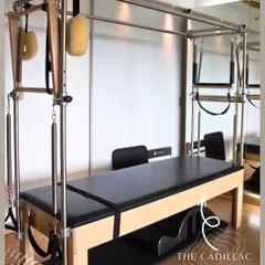 The Cadillac is one of the most versatile pieces of Pilates equipment. It allows for a huge range of exercises, from gentle stretches to highly advanced acrobatics.