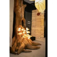 We brought a forest to life indoors for the 'Living Forest' exhibition. The centerpiece was this giant, sculptural tree, with glowing mushroom lights sprouting from its trunk. These lights were made from Lantana, an invasive weed, turning something destructive into an object of beauty and telling a powerful story of ecological balance.