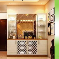 This is a crockery unit we designed with a mix of open and closed storage. It features glass shelves, a mirrored backsplash, and CNC-cut cabinet doors for a decorative touch.
