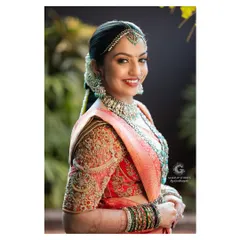 Likitha glowing with happiness on her wedding day. Her makeup was designed to be long lasting and picture perfect from every angle, ensuring she looked flawless throughout the long hours of her traditional ceremony.