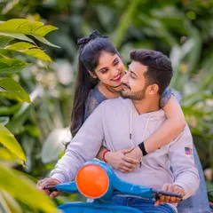 A cute and romantic moment on a scooter, surrounded by lush greenery. This shot is perfect for capturing the fun and carefree spirit of a couple's love story.