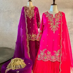 This collection features stunning sharara sets in vibrant jewel tones. The rich pink and magenta outfits are detailed with fine embroidery, making them ideal for festive gatherings.