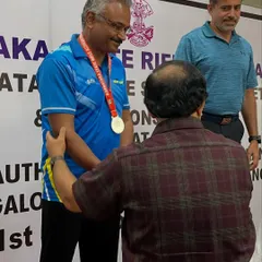 Congratulating one of our senior shooters on his medal-winning performance. Age is no barrier to success in this sport.