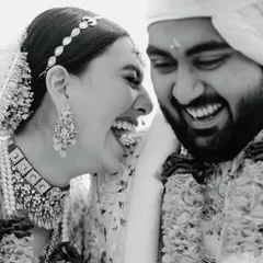 Pure, unadulterated joy. This candid black and white shot of Disha and Herin's laughter is infectious and captures the friendship at the heart of their marriage.