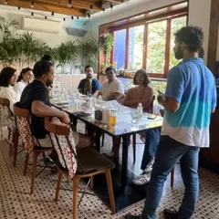 An instructor leads a discussion with an attentive group during a kombucha session. Our workshops are interactive, with plenty of time for questions and shared learning.
