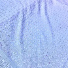 A classic light blue Chikankari material with delicate white embroidery. This fabric makes for a sophisticated and comfortable kurta suitable for any traditional gathering.