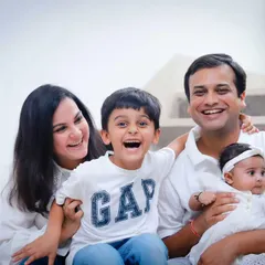 A burst of laughter on the stairs at home. We love finding great light and capturing real joy within your own house.