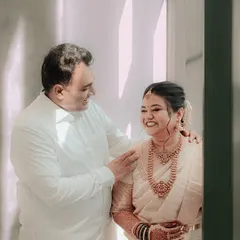 A heartwarming, candid moment between a bride and her father. The genuine laughter and affection in this photo make it a priceless memory.
