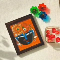 A beautiful 9x10 inch framed painting of Lord Srinathji, styled with small diyas. This piece is designed to be a perfect, heartfelt gift for any festival or special occasion.