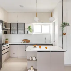My kitchens are designed to be the functional and beautiful heart of the home. This open island kitchen uses a light beige palette with sleek black accents, quartz countertops, and elegant pendant lighting to create an airy, sophisticated space for cooking and gathering.