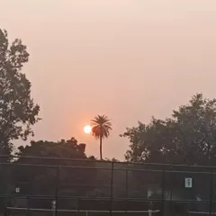The sun sets over our Noida tennis facility. A calm end to a day of intense training and competitive matches, highlighting the serene yet professional environment we cultivate.