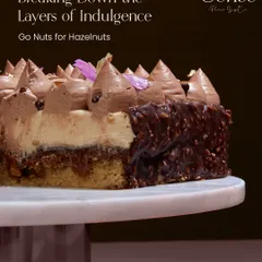 A closer look at the layers of my Go Nuts For Hazelnuts entremet. You can see the texture of the hazelnut crunch base, the soft sponge, and the creamy hazelnut mascarpone mousse. It is an intense and satisfying composition for any nut lover.