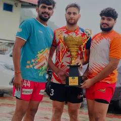 Three of our champion players posing with the trophy after their victory in Himachal. Teamwork is the foundation of our success.