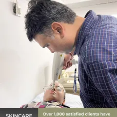 Here I am performing a laser skin treatment. I personally oversee procedures to ensure they are done correctly and safely.