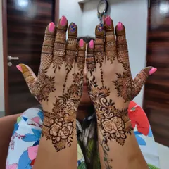 A fancy floral back of hand design that is perfect for a party! The climbing rose vine pattern is so romantic and chic, and it looks amazing with a fresh manicure.