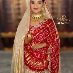 A frontal shot capturing the complete royal look. Notice the balance between the heavy jewelry and the clean, radiant makeup that enhances her natural features.