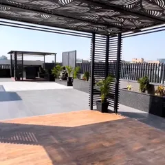 For clients seeking a bold, contemporary statement, we design and install custom metal pergolas. This expansive rooftop features multiple structures with intricate laser-cut patterns, transforming the area into a sophisticated architectural space.