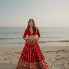 My bride looking radiant against the ocean backdrop in Thailand, her hair flowing like poetry.