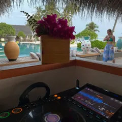 My view from the DJ booth at a beautiful poolside venue in the Maldives. This is the kind of experience that fuels my passion and my teaching.