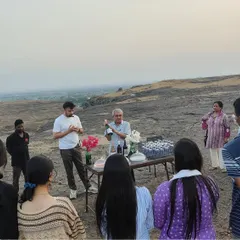 Learning about the world of wine doesn't happen in a classroom. Here, our hotel management students participate in an outdoor wine tasting session during an educational tour, gaining practical knowledge directly from experts in the field.