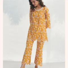 This mustard yellow co-ord set features intricate all-over embroidery. It’s a chic and modern alternative to a traditional kurta set.