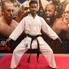 Demonstrating a fundamental karate stance. Proper form is the foundation of power, and we lead by example.