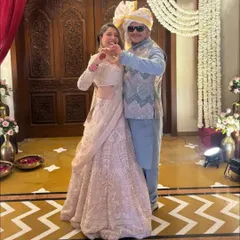 We love dressing up couples for their big moments. This client chose a beautiful pastel pink embroidered lehenga, and we paired it with a custom powder blue kurta and a sequined bandi jacket for him.