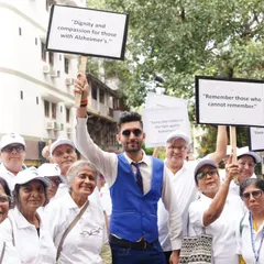 Holding up signs to "Remember those who cannot remember." Every step and every voice counts in the fight for awareness.