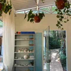 A glimpse of our studio, with shelves of student work waiting to be fired and the green garden just outside the door. It’s a space that holds so many stories of creativity and discovery.