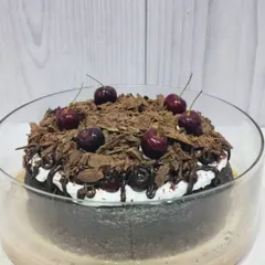 My Black Forest Tres Leches is a chocolate lover's dream. A rich chocolate cake is soaked in three milks and topped with whipped cream, chocolate shavings, and a cherry drizzle.