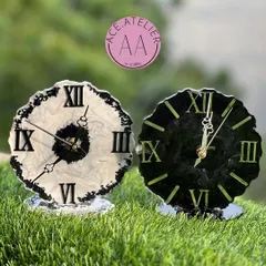 A pair of striking black and white table clocks with a marble effect. These modern, geode-style clocks are perfect for adding a touch of sophistication to a desk or shelf.