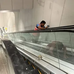 A worker giving the final touches to an escalator installation. We supervise every detail, ensuring that mechanical, electrical, and plumbing (MEP) systems are integrated perfectly into our designs.