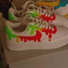 It's dripping neons. I love playing with this melting paint effect, and the bright neon green, yellow, and red colors on these Nike Air Force 1s create a super fun and vibrant look.