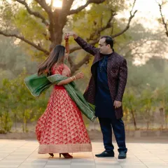 A playful twirl in the garden. This photo captures a lighthearted, in-between moment that feels more authentic than any stiff pose. The movement in her lehenga adds a beautiful, dynamic element.