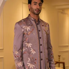 Our mauve Jodhpuri ensemble is a testament to detailed craftsmanship. The intricate floral embroidery and beadwork create a sophisticated look that is both unique and timeless.
