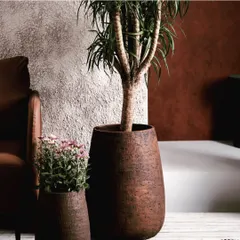 This is a piece from my 'Modernistic Enigma' collection. These large, textured GRC planters are designed to be bold outdoor accents that combine innovative design with botanical beauty, transforming any green space.