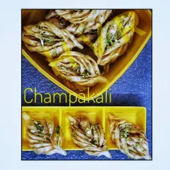 Champakali is a beautiful sweet inspired by the frangipani flower. This crispy, layered pastry is soaked in sugar syrup and is a popular sweet in Western Maharashtra.
