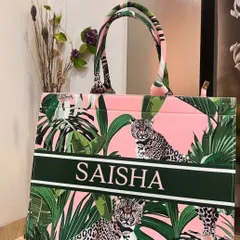 This pink and green leopard print suede tote bag is fierce and fabulous. It's personalised with the name 'Saisha' in a bold font.
