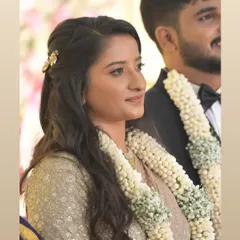 A beautiful candid shot of a client during her ceremony. She looks serene and confident, fully present in her special moment.