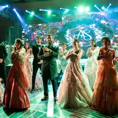 A perfectly planned flashmob entry for the bride and groom. The performance started with their friends and family, building up to the couple's grand entrance, creating an exciting and inclusive start to the Sangeet.