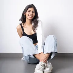 A relaxed, smiling portrait from a model test shoot. This natural and approachable look is essential for a portfolio, showing a different side from more serious, high-fashion shots.