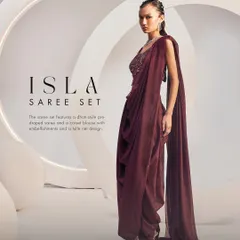 This is my Isla Saree Set in a rich wine hue. I designed it with a modern dhoti-style drape and an intricately embellished corset blouse, creating a fusion look that is both powerful and elegant.