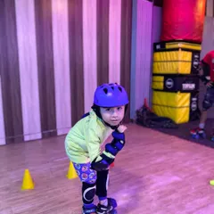 A young skater getting ready for practice. We make sure every child is comfortable and secure in their safety gear before they start.