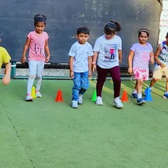 Follow the leader! Simple drills like walking or running through cones help improve a child's spatial awareness and ability to follow directions. It's a foundational skill for learning more complex sports later on.