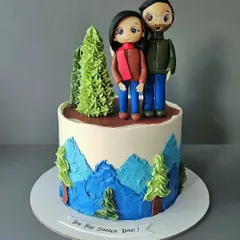 Bye bye single days! A fun cake for a couple who loves hiking. This vanilla and salted caramel cake features custom figurines of the couple, ready for their next adventure together.